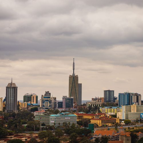 Explore the vibrant skyline of Nairobi with its modern skyscrapers under an overcast sky.