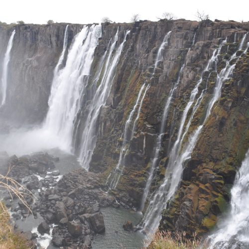 Stunning view of Victoria Falls cascading powerfully over rugged cliffs.